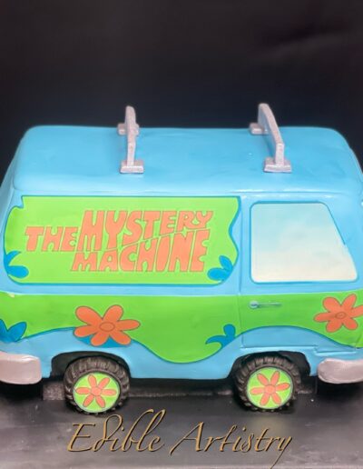 Scooby-Doo Mystery Machine van cake with colorful retro detailing