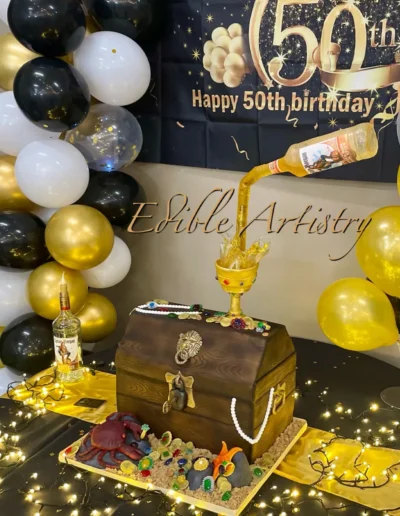 Pirate treasure chest cake with a floating bottle and edible treasure detailing
