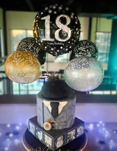 Luxury 18th birthday cake with balloon topper and tuxedo-themed detailing