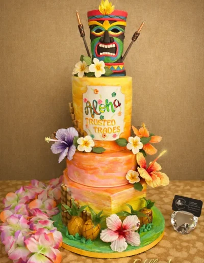 Tropical tiki-themed cake with floral decorations and island-inspired detailing
