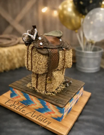 Custom western saddle cake with realistic leather and hay bale detailing