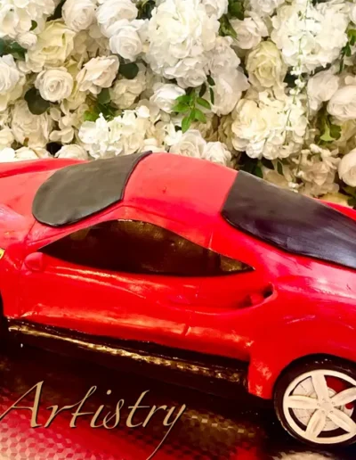 Custom red Ferrari car cake with realistic sports car detailing