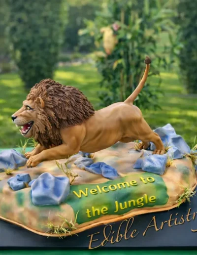 Custom lion sculpted cake with jungle-themed edible detailing