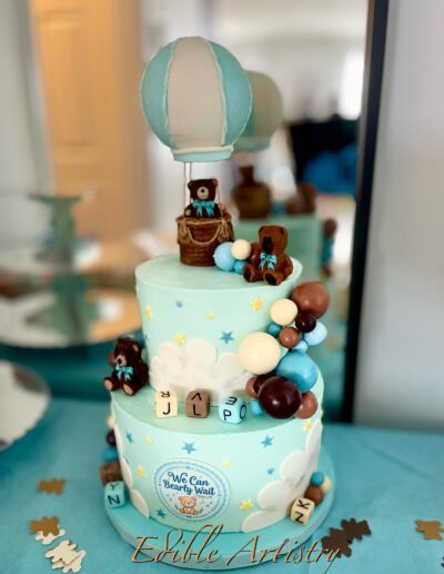 Baby shower cake with teddy bears, hot air balloon, and pastel blue detailing
